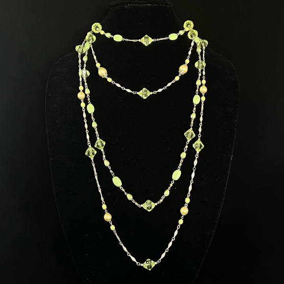 Multi tiered necklace with green beads and crystal and pearls in silver setting